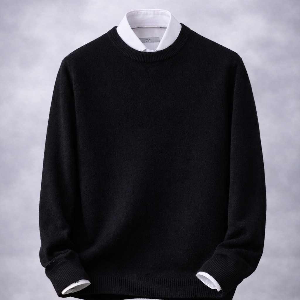 Black sweater with white collar and cuffs on a wooden surface and gray background