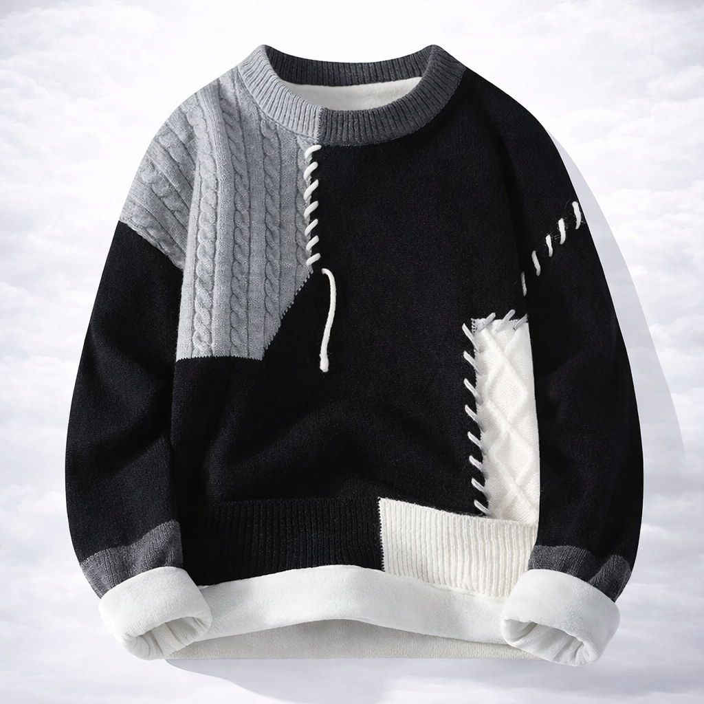 Black and gray sweater with white accents on a white background